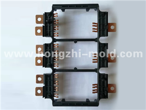 Injection molded embedded metal parts